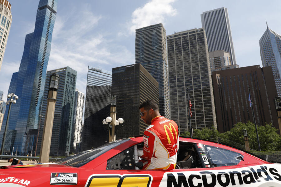 Bubba Wallace gets into his car before driving around downtown Chicago in promotion of the NASCAR Chicago Street Race announcement on July 19, 2022 in Chicago, Illinois. (Photo by Patrick McDermott/Getty Images)